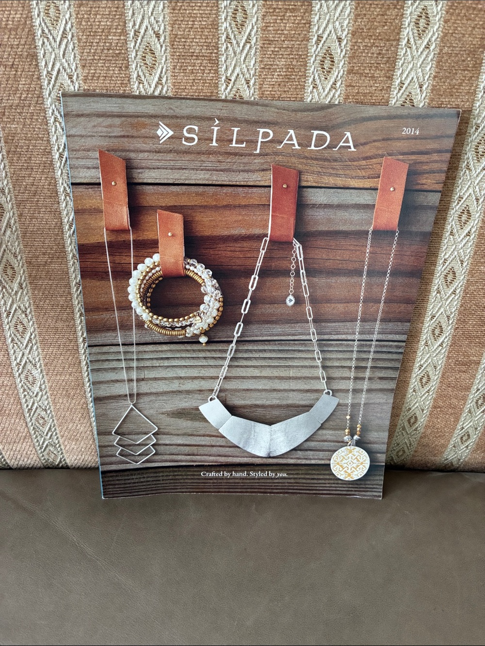 Silpada 2014 catalogue. Like new condition. No rep back stamp.